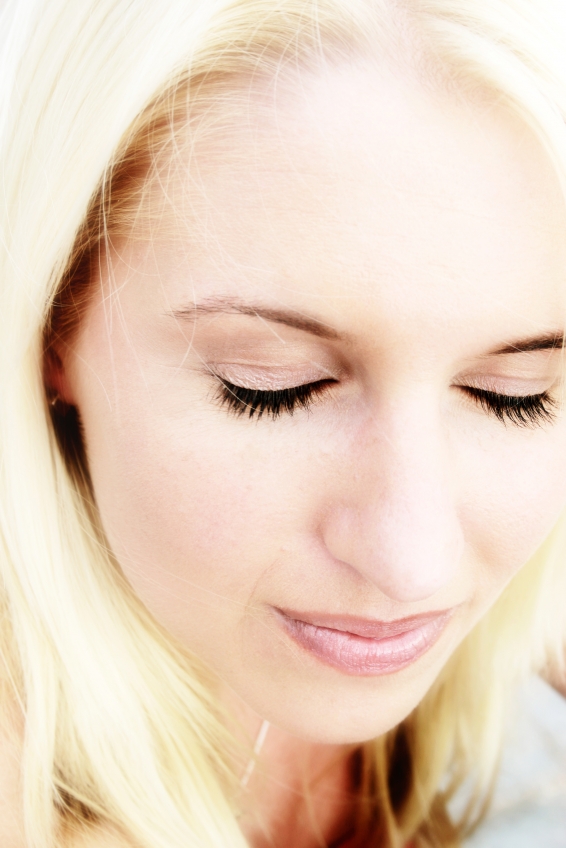 Hypnosis for Winning - Woman with Eyes Closed Praying or Meditating