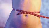 Hypnosis for Ultimate Weight Loss - Woman with Tape Measure Around Waist